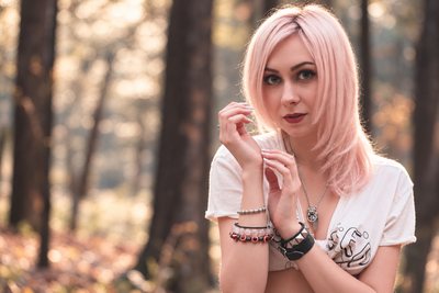 Model in a white shirt in an autumn wood