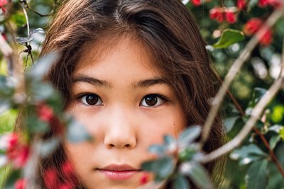 Close portrait framed by red berries